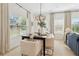 Well-lit dining area featuring a modern table set and large windows at 432 Carrera Ln, Acworth, GA 30102
