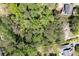 An aerial view shows the yellow boundary lines for a wooded lot, perfect for building a custom home at 4140 Westchester Ne Xing, Roswell, GA 30075