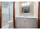 Bathroom featuring a single sink vanity with drawers, mirror, and separate shower and toilet at 4140 Westchester Ne Xing, Roswell, GA 30075
