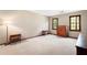 Spacious bedroom with neutral walls, carpet, two windows, and wooden furniture at 4140 Westchester Ne Xing, Roswell, GA 30075