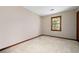 Neutral bedroom featuring plush carpeting and a wood trimmed window at 4140 Westchester Ne Xing, Roswell, GA 30075
