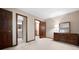 Bedroom featuring neutral walls, carpet, and a wood dresser with mirror at 4140 Westchester Ne Xing, Roswell, GA 30075