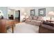 Comfortable living room featuring neutral carpet, sofa, side tables, and decor at 4140 Westchester Ne Xing, Roswell, GA 30075