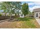 View of a spacious backyard featuring a fire pit and a storage shed at 5450 Fieldfreen Dr, Cumming, GA 30028