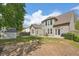 Expansive backyard view featuring a fire pit, storage shed, and patio with outdoor seating at 5450 Fieldfreen Dr, Cumming, GA 30028