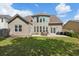 Large backyard featuring a patio with seating, a grill, lush lawn and privacy fence at 5450 Fieldfreen Dr, Cumming, GA 30028
