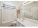 Clean bathroom featuring tub and shower, vanity with sink, and good lighting at 5450 Fieldfreen Dr, Cumming, GA 30028