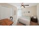 Cozy bedroom featuring a desk, and closet, ideal for work and relaxation at 5450 Fieldfreen Dr, Cumming, GA 30028