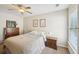Bright bedroom featuring a ceiling fan, closet and a sunny window offering ample natural light at 5450 Fieldfreen Dr, Cumming, GA 30028