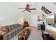Bright finished bonus room featuring vaulted ceilings, a sofa, and a tv at 5450 Fieldfreen Dr, Cumming, GA 30028