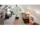 Large finished bonus room featuring vaulted ceilings, a tv, and a sofa at 5450 Fieldfreen Dr, Cumming, GA 30028