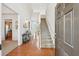 Inviting foyer with hardwood floors, a staircase, and ample natural light, creating a warm entrance at 5450 Fieldfreen Dr, Cumming, GA 30028