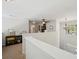 Bright upstairs landing with chandelier, study area, and views to the foyer at 5450 Fieldfreen Dr, Cumming, GA 30028