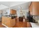 Well-lit kitchen features a central island, stainless steel appliances, and wooden cabinetry at 5450 Fieldfreen Dr, Cumming, GA 30028