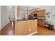 Well-lit kitchen features a central island, stainless steel appliances, and wooden cabinetry at 5450 Fieldfreen Dr, Cumming, GA 30028