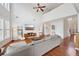 Bright, open-concept living room with high ceilings, hardwood floors, and modern decor at 5450 Fieldfreen Dr, Cumming, GA 30028