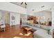 Spacious living area features hardwood floors, high ceilings, a cozy fireplace, and an open layout at 5450 Fieldfreen Dr, Cumming, GA 30028