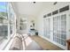 Comfortable sunroom with ample natural light and access to the outdoor space at 5450 Fieldfreen Dr, Cumming, GA 30028