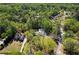 Serene aerial shot of the property nestled among mature trees, with pool, set back from the neighborhood at 629 Concord Sw Rd, Smyrna, GA 30082