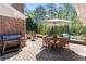 Outdoor patio with a grill, an umbrella table, and additional seating by the pool at 629 Concord Sw Rd, Smyrna, GA 30082