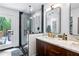 Bathroom with wood vanity, marble countertop, glass shower, and a door to a deck at 629 Concord Sw Rd, Smyrna, GA 30082
