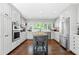 Modern kitchen featuring white cabinets, stainless steel appliances, and a center island at 629 Concord Sw Rd, Smyrna, GA 30082