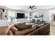 Bright living room featuring a large leather sofa, built-in shelving, and modern decor at 629 Concord Sw Rd, Smyrna, GA 30082