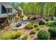 Aerial view of a home that features a patio dining set and an outdoor kitchen with a built in grill at 1000 Holly St, Canton, GA 30114