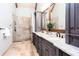 Elegant bathroom with dual sinks, granite countertop, walk-in shower with glass door at 1000 Holly St, Canton, GA 30114