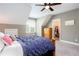 Cozy bedroom featuring a vaulted ceiling, comfortable bed, dresser, and a view of the window at 1000 Holly St, Canton, GA 30114