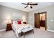 Stylish bedroom showcasing a decorative bed frame, wood bedside tables, and ensuite bathroom at 1000 Holly St, Canton, GA 30114
