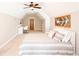 Bedroom with a ceiling fan, bed, decorative arrow art, desk, and great natural light at 1000 Holly St, Canton, GA 30114