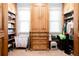 Walk-in closet featuring custom wood storage systems with shelving and hanging rods at 1000 Holly St, Canton, GA 30114