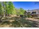 Exterior of the house with a well-manicured lawn, well-placed shrubbery, and a screened porch at 1000 Holly St, Canton, GA 30114