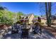 View of the home from the firepit area, highlighting the expansive backyard and natural surroundings at 1000 Holly St, Canton, GA 30114