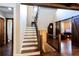 Inviting foyer with hardwood floors, staircase, barn door to the living room and 2-story ceilings at 1000 Holly St, Canton, GA 30114