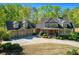 Beautiful two-story house with a well-manicured lawn and a spacious driveway to a three-car garage at 1000 Holly St, Canton, GA 30114