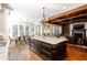Open kitchen with an island flows into the living room and dining area with ease at 1000 Holly St, Canton, GA 30114