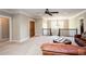 Bright living room boasts hardwood doors, a ceiling fan, and comfortable leather seating at 1000 Holly St, Canton, GA 30114