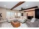 Living room features a comfortable couch, an accent chair, wooden beams, and a view of the kitchen at 1000 Holly St, Canton, GA 30114