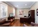 Home office featuring hardwood floors, a desk, and comfortable seating at 1000 Holly St, Canton, GA 30114