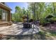The backyard features a large stone patio with an outdoor grill area, an outdoor seating area at 1000 Holly St, Canton, GA 30114
