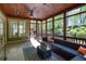 Inviting screened porch with comfortable seating and views of the lush backyard at 1000 Holly St, Canton, GA 30114