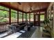 Inviting screened porch with comfortable seating and views of the lush backyard at 1000 Holly St, Canton, GA 30114