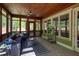 Inviting screened porch with comfortable seating and views of the lush backyard at 1000 Holly St, Canton, GA 30114