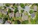 An aerial view of a neighborhood with well-maintained yards and mature trees at 265 Lily Cove Dr, Loganville, GA 30052