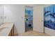 Bathroom featuring a vanity with a doorway that reveals a bunk bed inside an adjacent bedroom at 265 Lily Cove Dr, Loganville, GA 30052