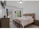 Cozy bedroom with a queen-sized bed, neutral walls, and windows at 265 Lily Cove Dr, Loganville, GA 30052
