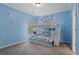 bedroom with a white bunk bed and light blue walls at 265 Lily Cove Dr, Loganville, GA 30052
