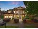 Stately brick home with two-car garage, columned porch, landscaped yard, and inviting curb appeal at 265 Lily Cove Dr, Loganville, GA 30052